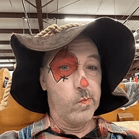 Scarecrow face paint in a straw hat