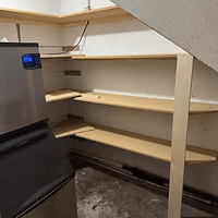 New concession shelving under the stairs