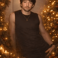 A holiday portrait beside a lit garland